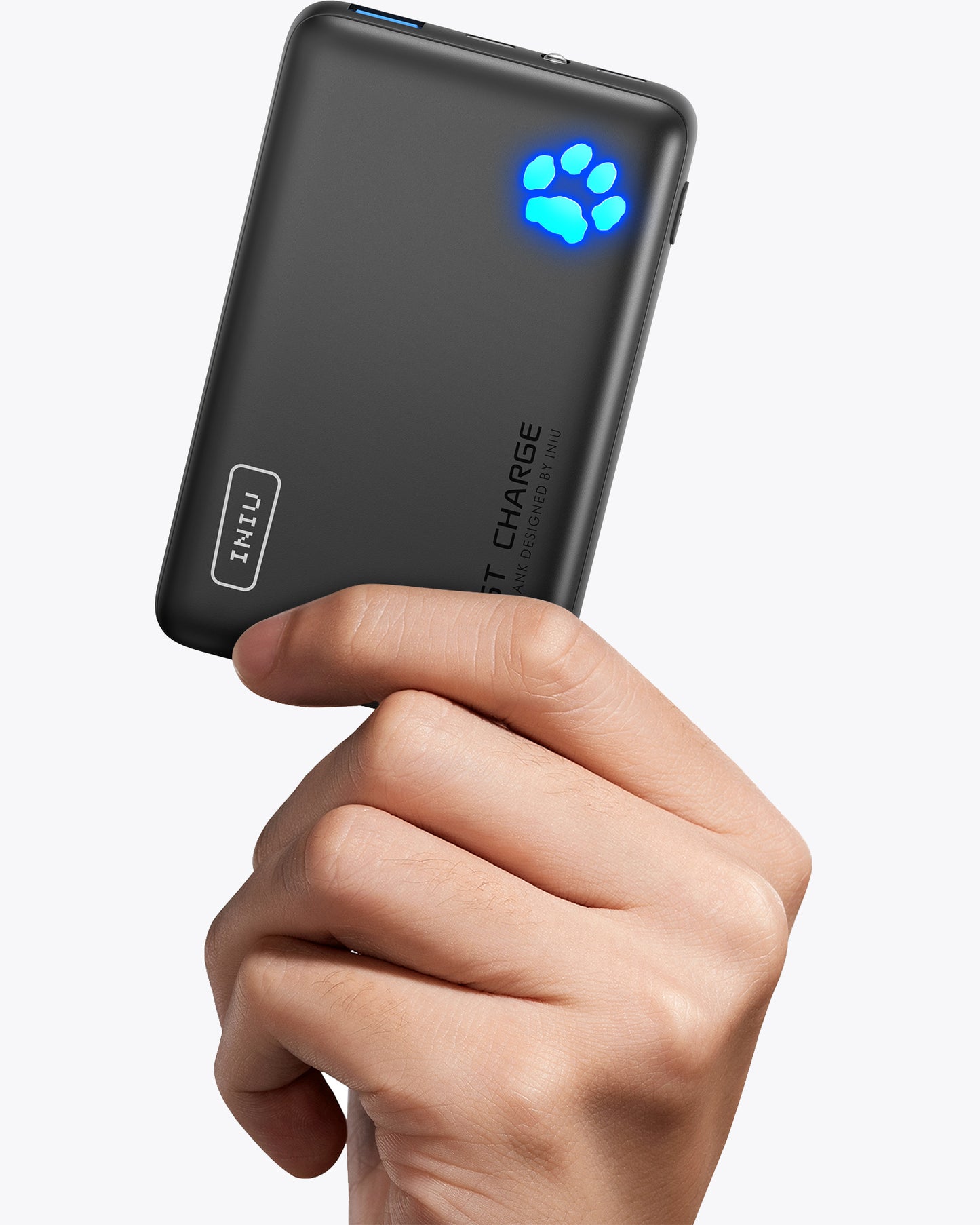 INIU P41-E1 Power Bank held in hand. Black portable charger with Fast Charge, paw indicator.