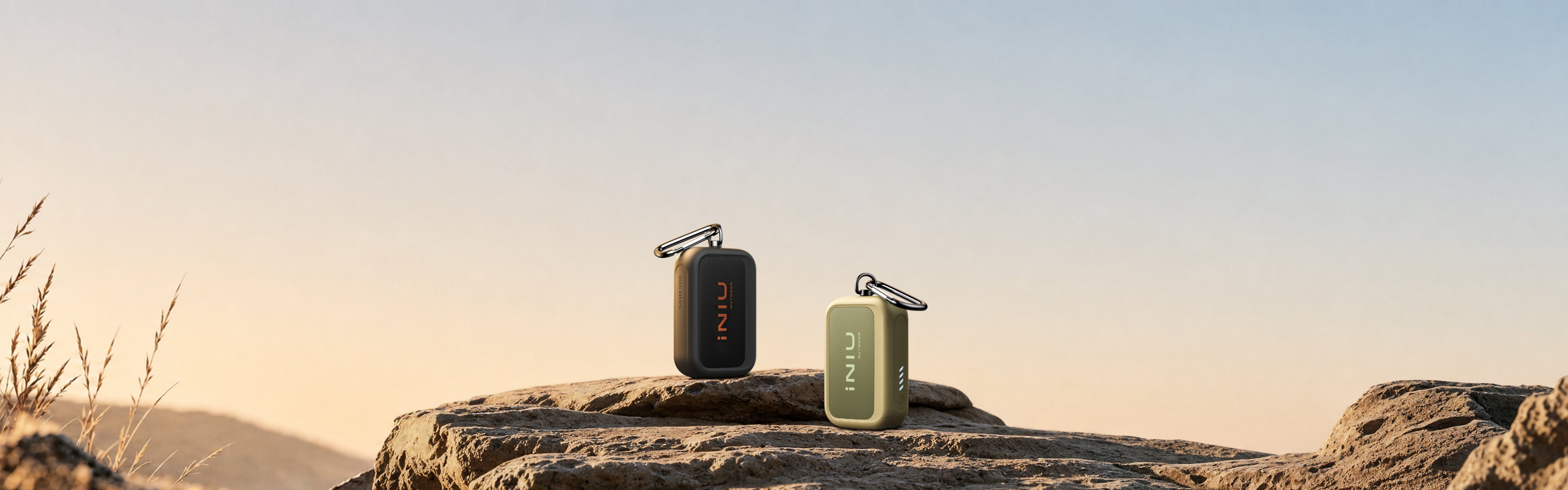 INIU Outdoor Rugged 10000 power banks on a rocky outdoor landscape