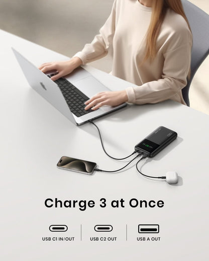 INIU B64 Power Bank: Charge 3 devices at once, including laptop, phone, and earbuds.